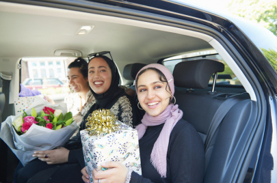 girls wearing hijab happy inside a car 